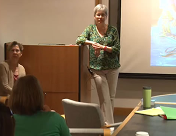 A teacher holding a semiar