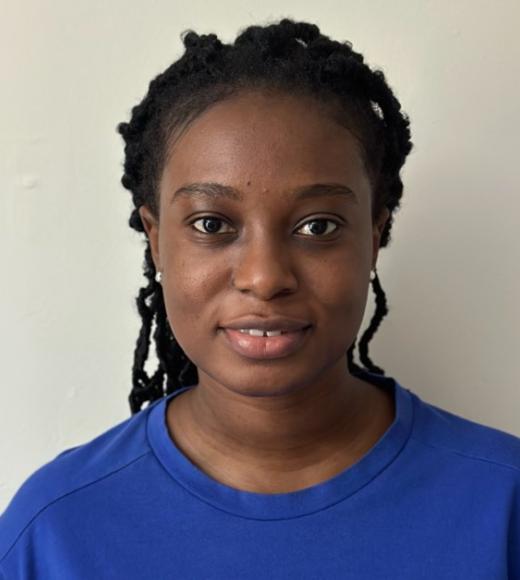 Christabel Domfe, headshot, in dark blue sweatshirt