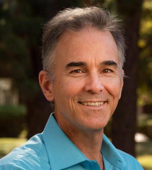 Paul Hastings face photo, in aqua blue shirt