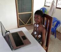 iLinS Dyad Study Subject Boy hooked up to laptop, Ghana